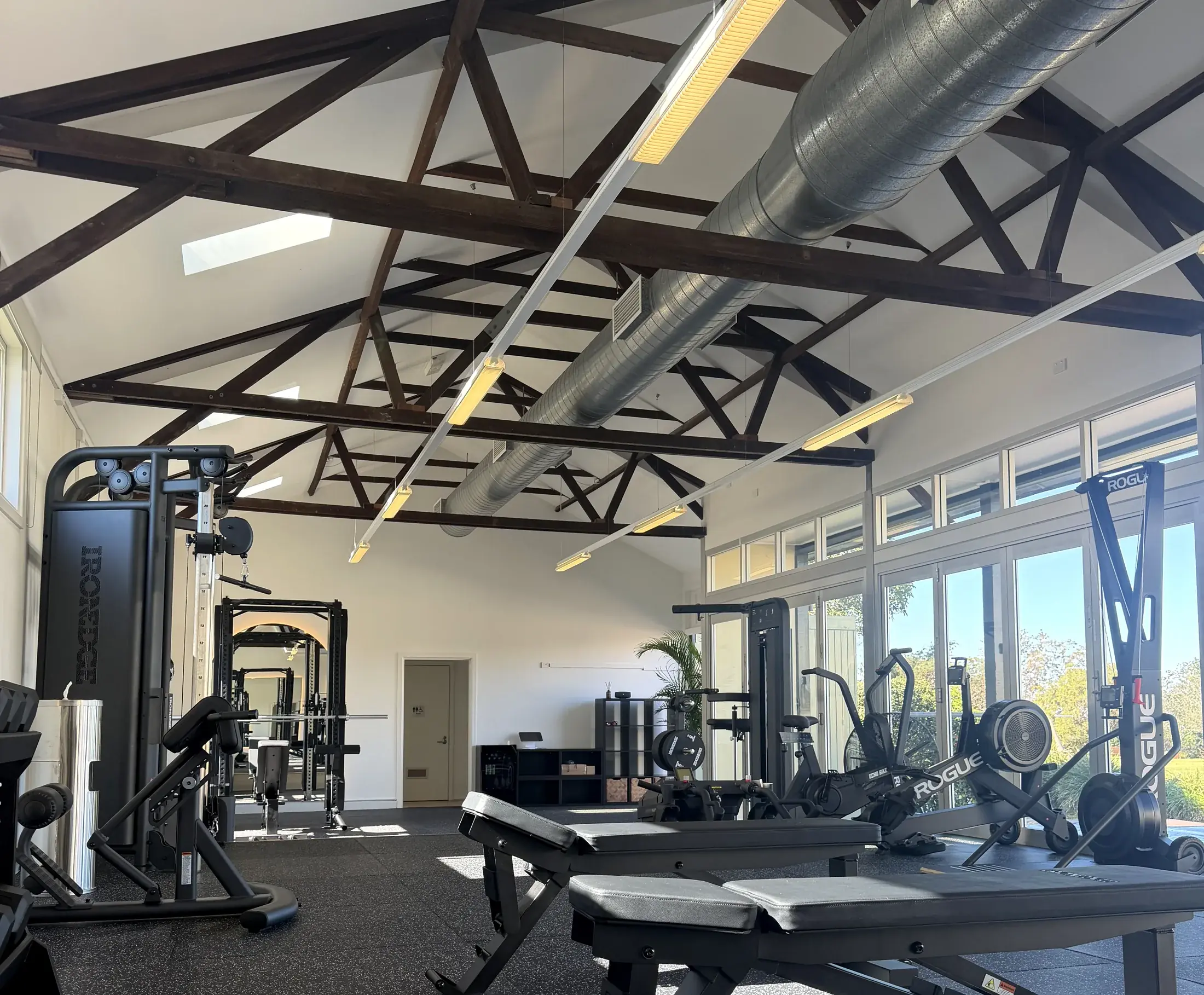 Wide view of the Headland Strength and Performance studio, showing the rig, cable stations and open glass doors